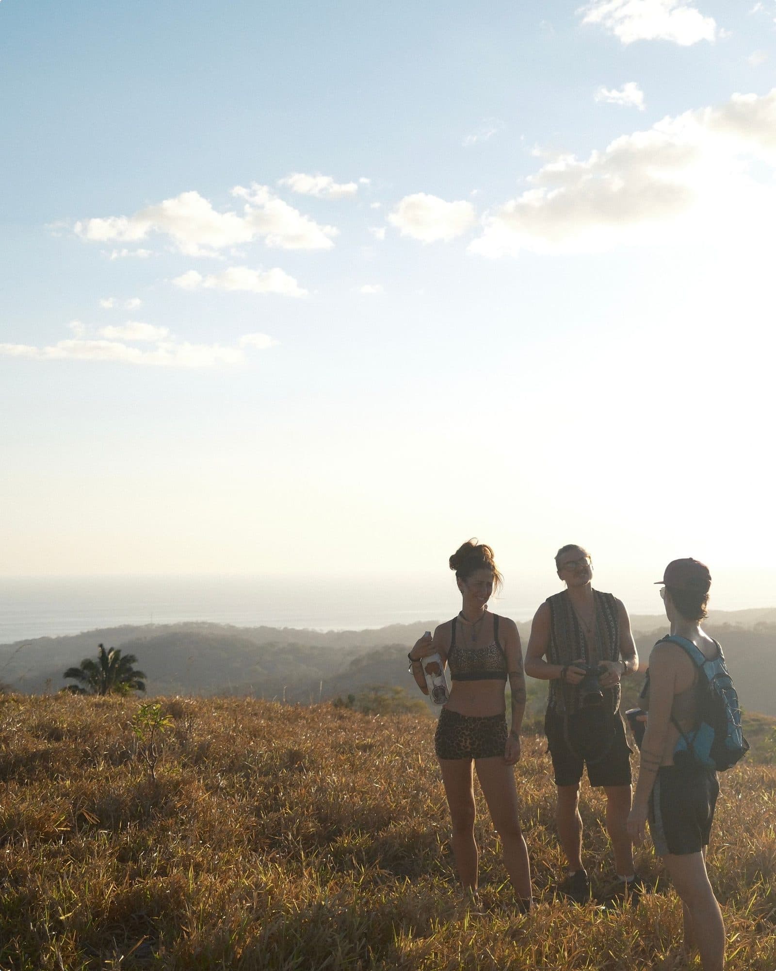 A group of residents pausing on a hilltop trail