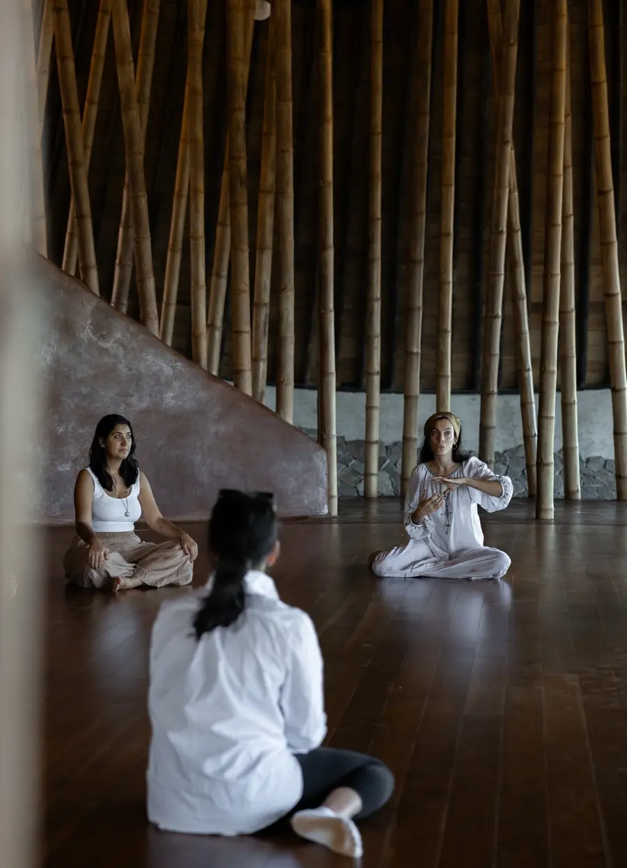 Residents sitting together on the movement studio floor